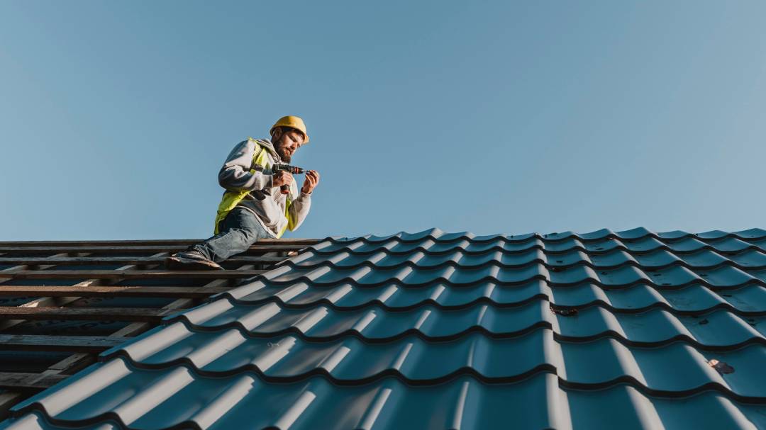 long-shot-man-working-roof (1)